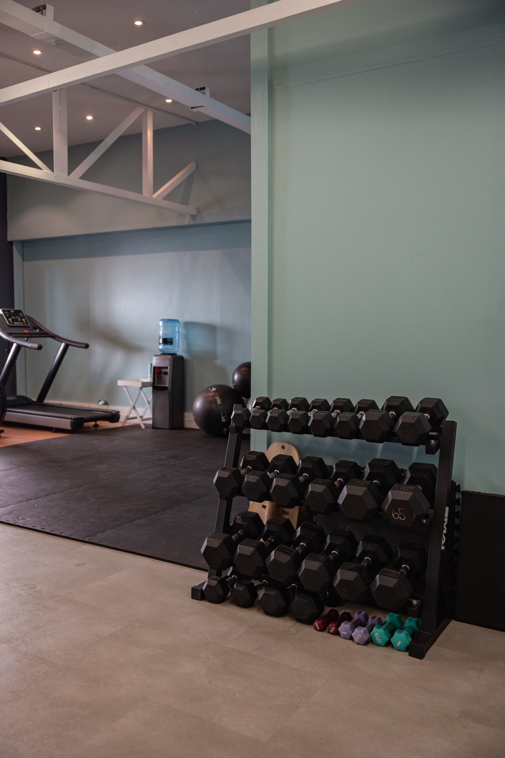 Dumbbell and free-weight training area in the Green Point practice